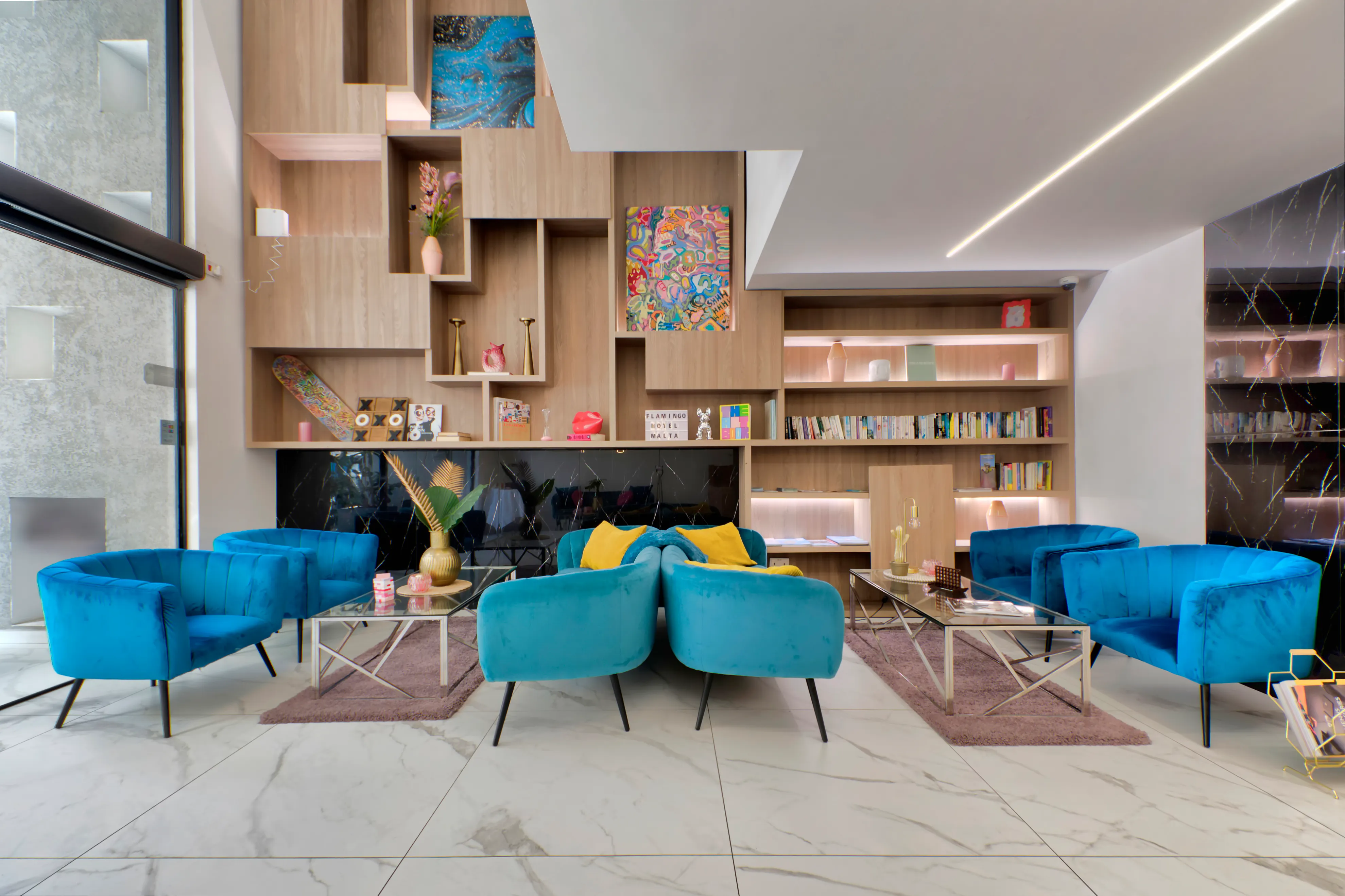 Flamingo Hotel lobby with blue velvet chairs and modern décor