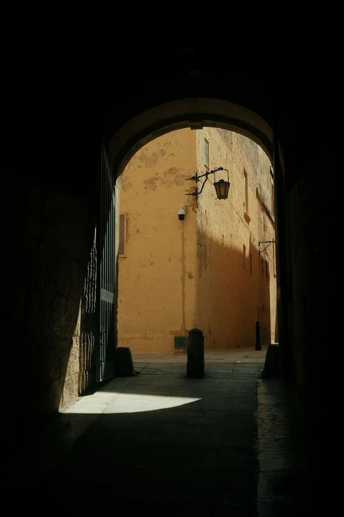 Medieval stone archway in the narrow streets of Mdina